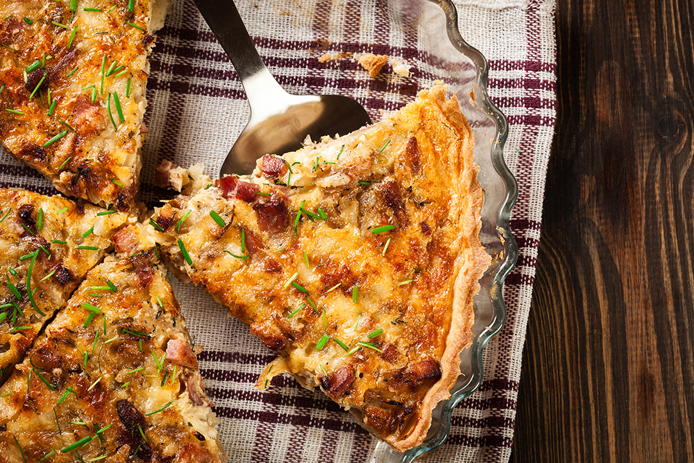 Pieces of quiche lorraine with bacon and cheese. French cuisine